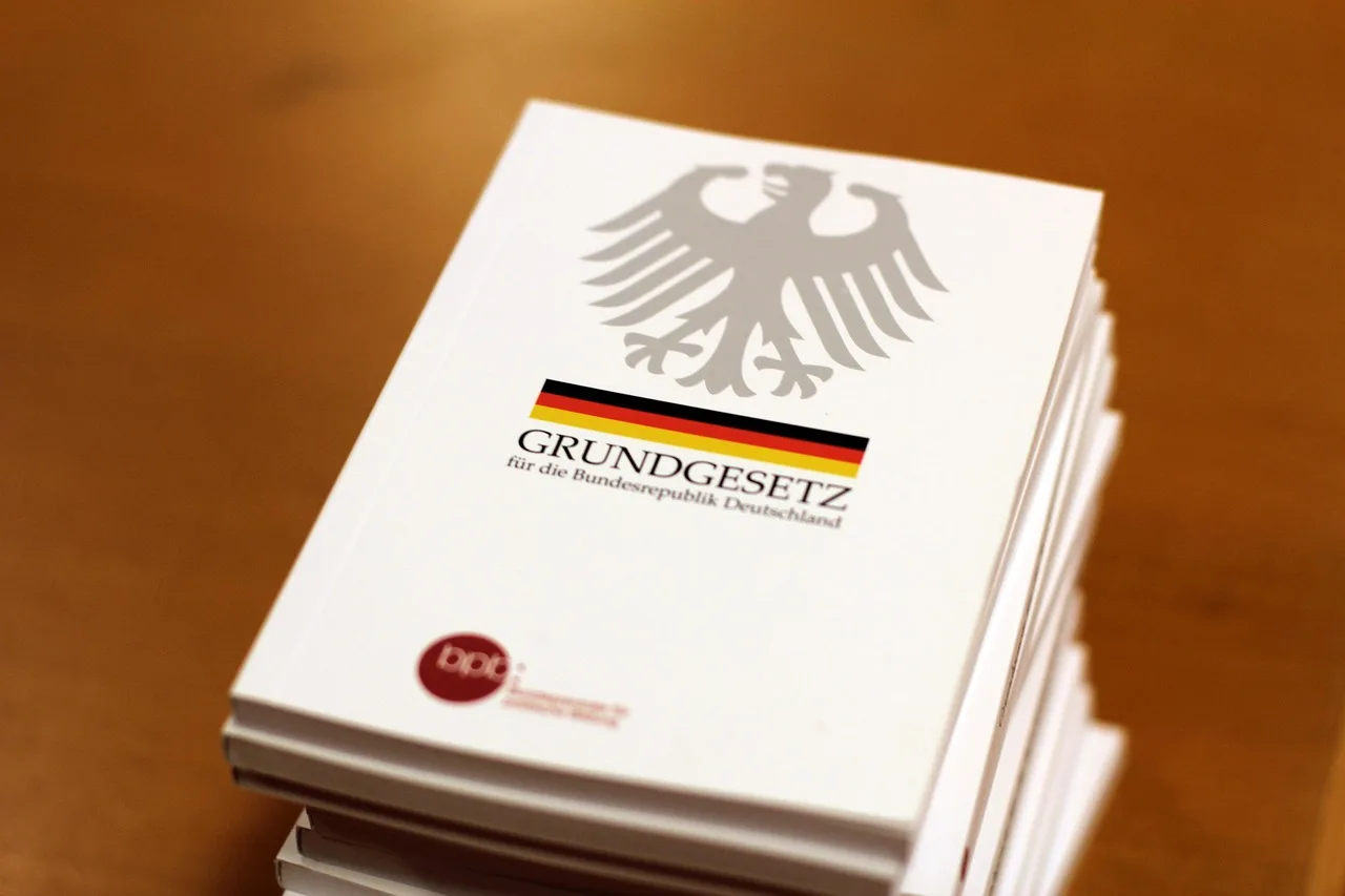The counter-view: the basic law, germany, a book, imperial eagle, book stack