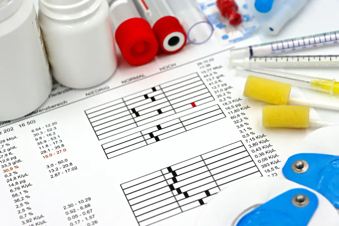 Liver and kidney: Arrangement of medical equipment, lab tests, and health data on a clinical table.