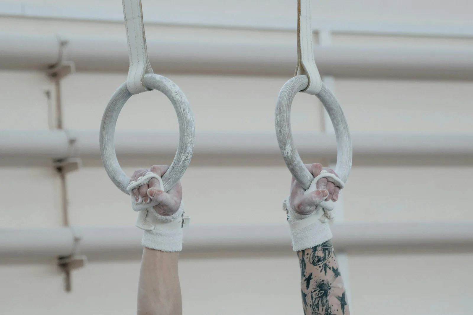 Reference ranges by age and sex: Close-up of hands gripping gymnastic rings, showcasing training essentials and focus.