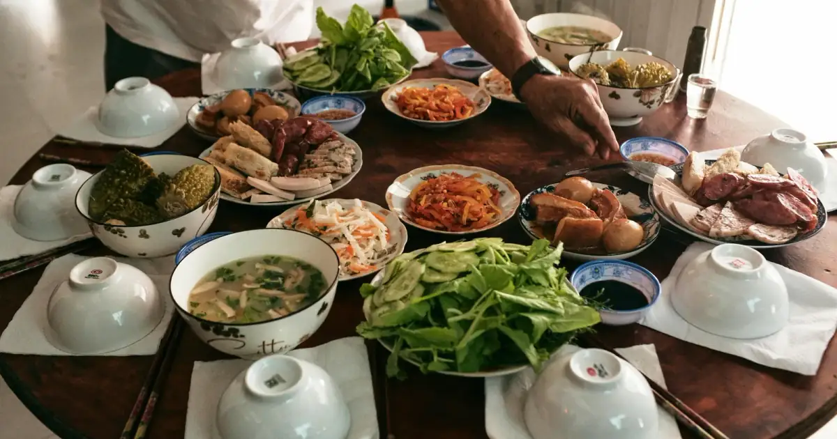 A vibrant table setting showcasing a traditional Vietnamese Lunar New Year meal in Ben Tre.