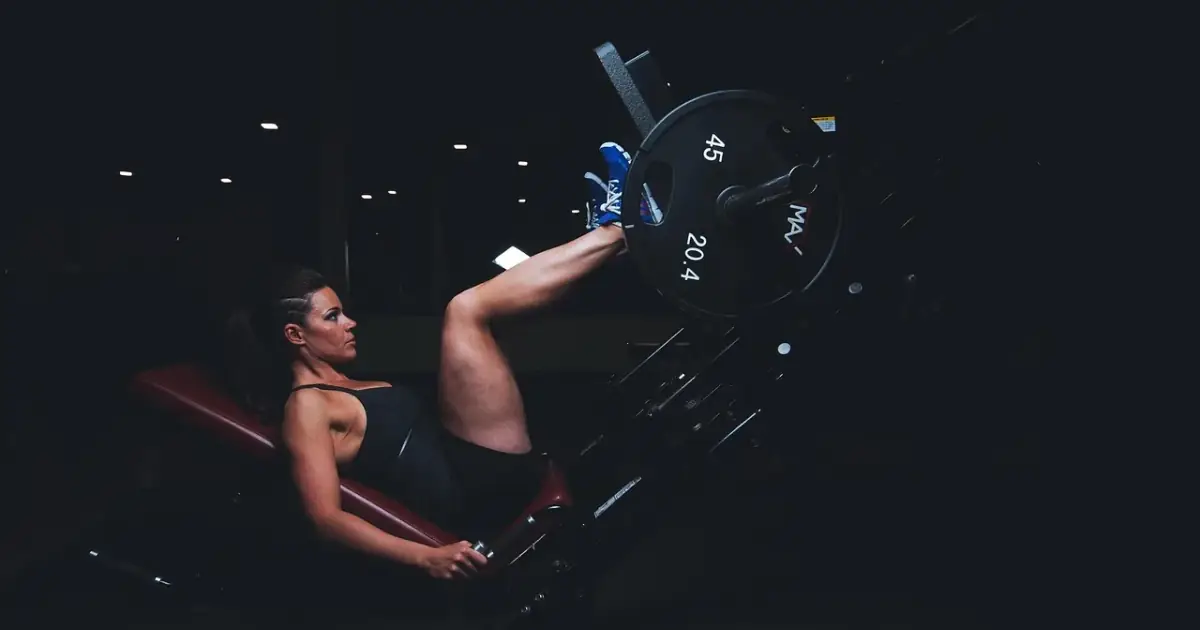 adult, gym, athlete, dark, energy, exercise, exercise equipment, female, fit, fitness, girl, healthy, legs, muscles, plates, strength, strong, sweat, training, woman, workout, workout gear, push, blue fitness, blue gym, 