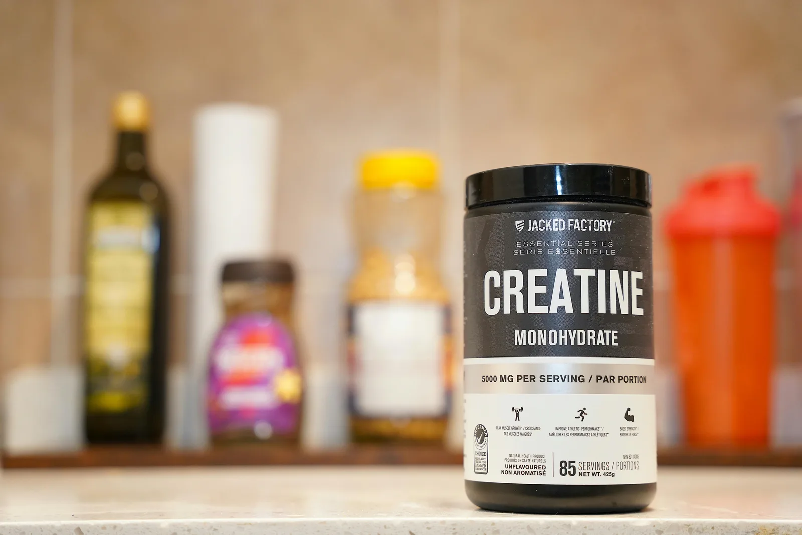 Form: monohydrate beats everything else: Creatine monohydrate from Jacked Factory displayed on a kitchen counter.