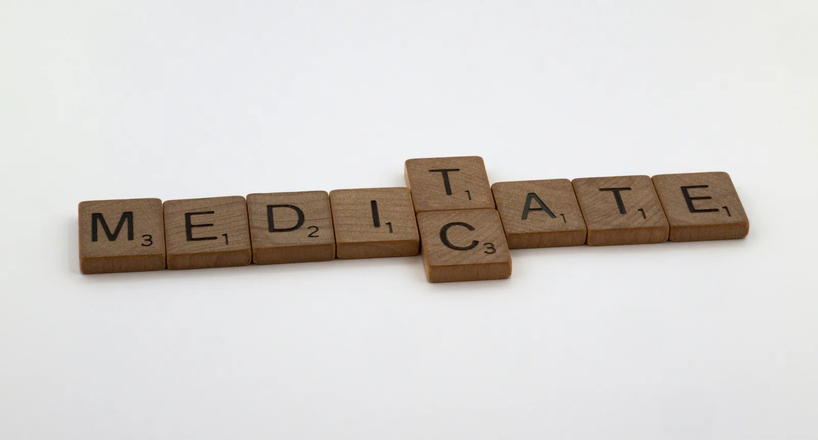 What are the four horsemen of premature death?: a crossword spelling out the word meditate on a white background