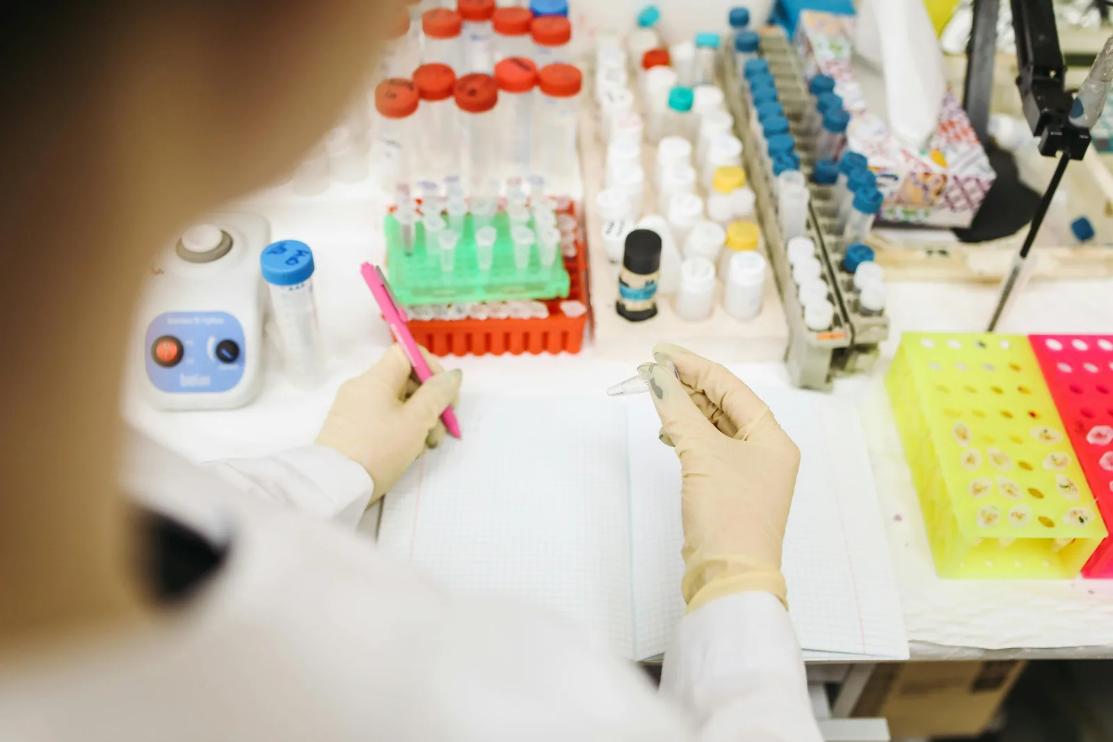 Curcumin and piperlongumine: the long tail: Scientist analyzing samples in a lab with various test tubes and equipment.
