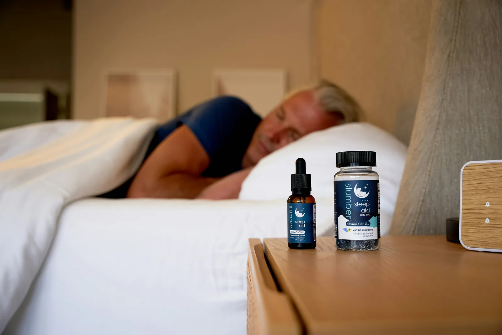 Apigenin, 50 mg 30-60 minutes pre-bed: a man sleeping on a bed next to a bottle of cb