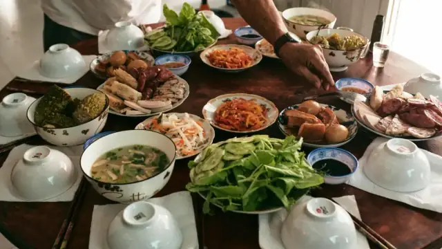 A vibrant table setting showcasing a traditional Vietnamese Lunar New Year meal in Ben Tre.